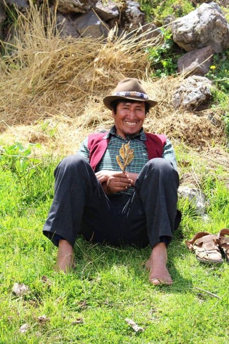 Tupaq sitting with flowers